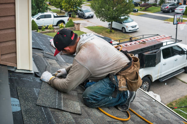 Professional Roof Replacement technician working in Armington, IL